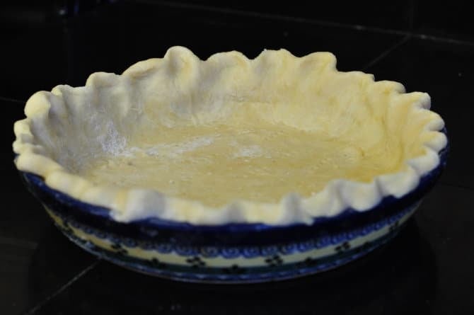 A photo of a homemade pie crust ready to be filled