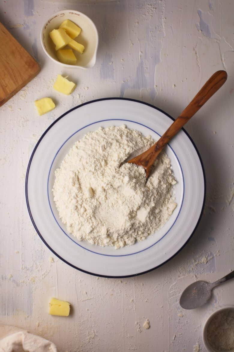 Overhead view of homemade baking mix in white bowl.