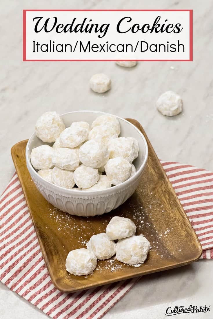 A white bowl of Italian Wedding cookies on a red and white striped napkin with text overall.