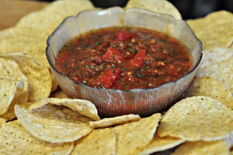 Easy homemade salsa in a small glass bowl with chips