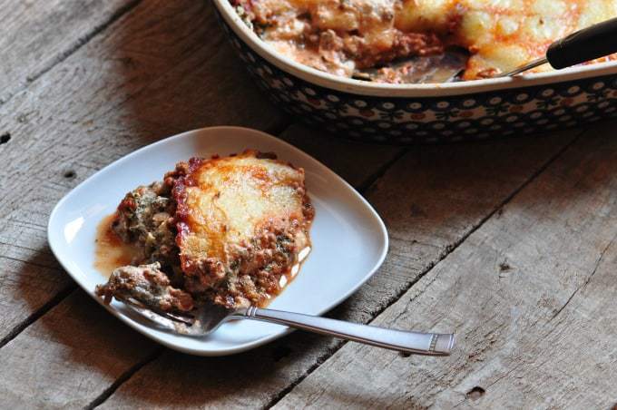 A slice of easy spinach lasagna made from the spinach lasagna recipe on a white plate