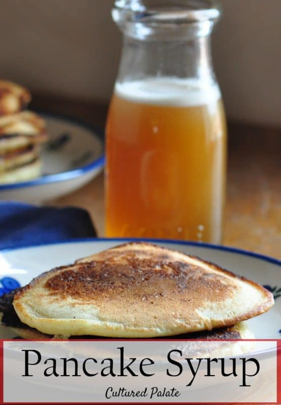 pancake syrup recipe shown in bottle with pancakes in front