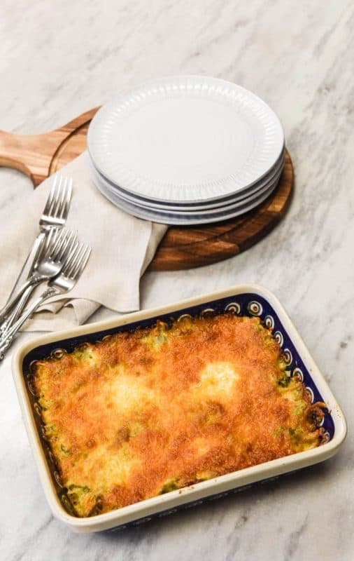 Easy Broccoli Casserole shown on table vertical image