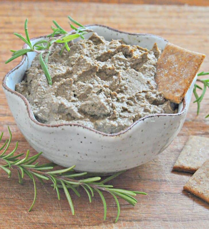 Liver Recipe - Liver Pate shown in bowl with cracker and rosemary sprigs
