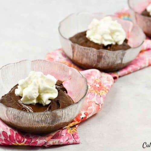Avocado Chocolate Pudding  - 3 bowls filled with pudding and topped with whipped cream