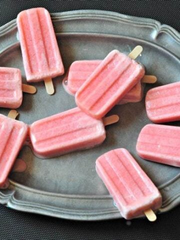 strawberry healthy kefir popsicles on a plate