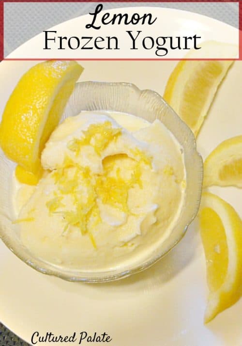 Lemon Frozen Yogurt shown in bowl with lemon wedges around it