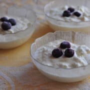 Three glass bowls filled with homemade yogurt