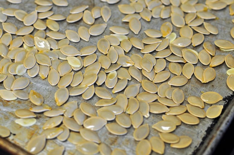 Pumpkin seeds on a large tray ready to be toasted
