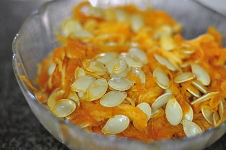 A photo of a bowl of squash seeds that were removed from a squash