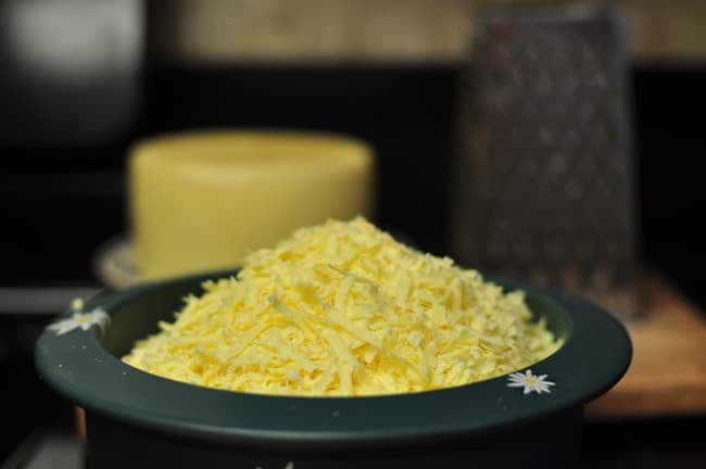 grated cheese on a plate ready to cook cheese fondue