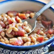 Homemade Baked Bean Recipe shown in bowl with spoon ready to eat