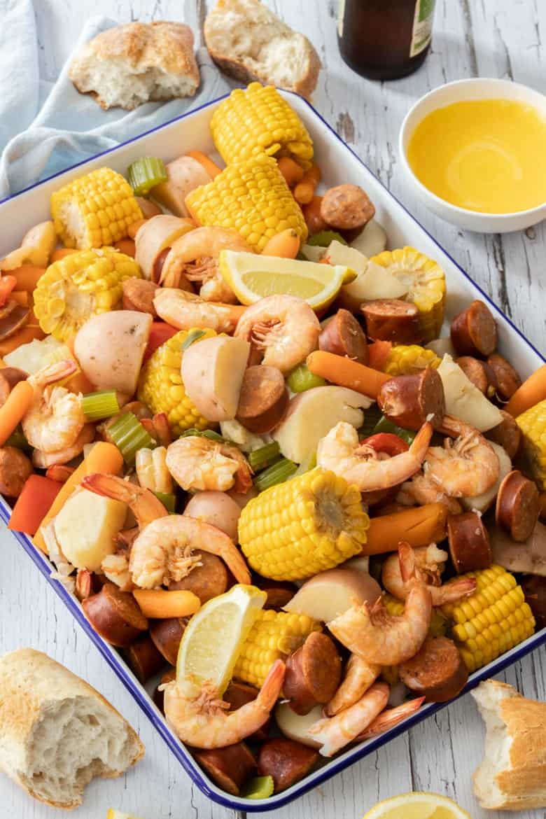 Vertical image of Shrimp Boil recipe or Low Country Boil recipe in enamel serving dish.