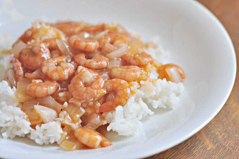 Shrimp with tomato sauce shown on plate