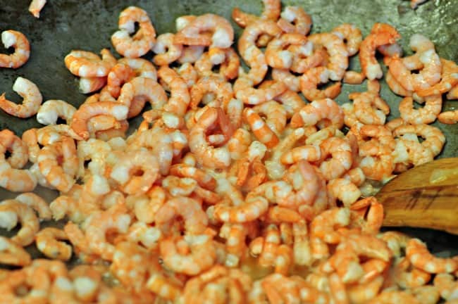 A close up of shrimp in a wok to make shrimp in tomato sauce