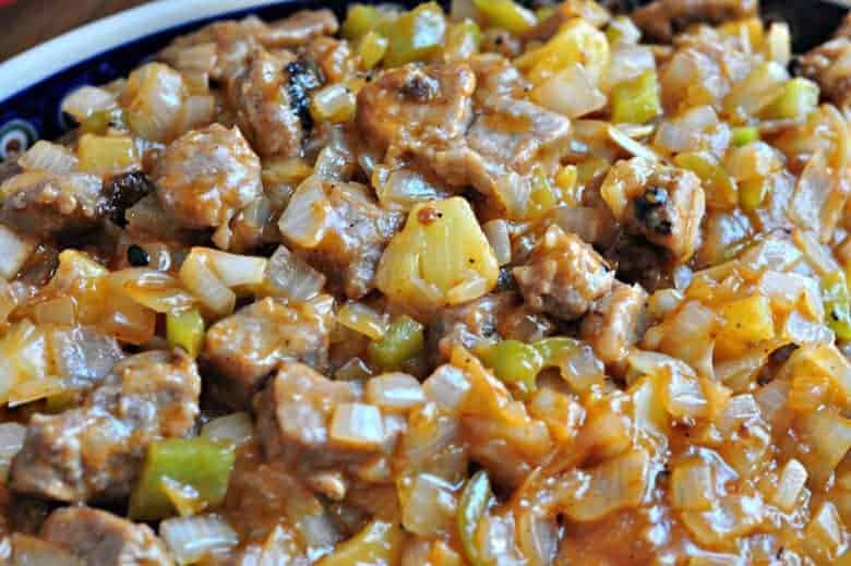 A close up of Chinese sweet and sour pork on a plate