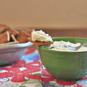 Ricotta cheese recipe shown made in a bowl and on a cracker from the post, how to make ricotta cheese