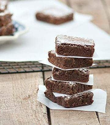 Easy Brownies shown stacked on paper