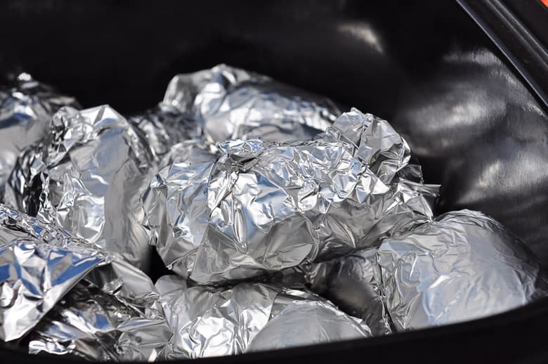 Crock pot baked potatoes wrapped in foil