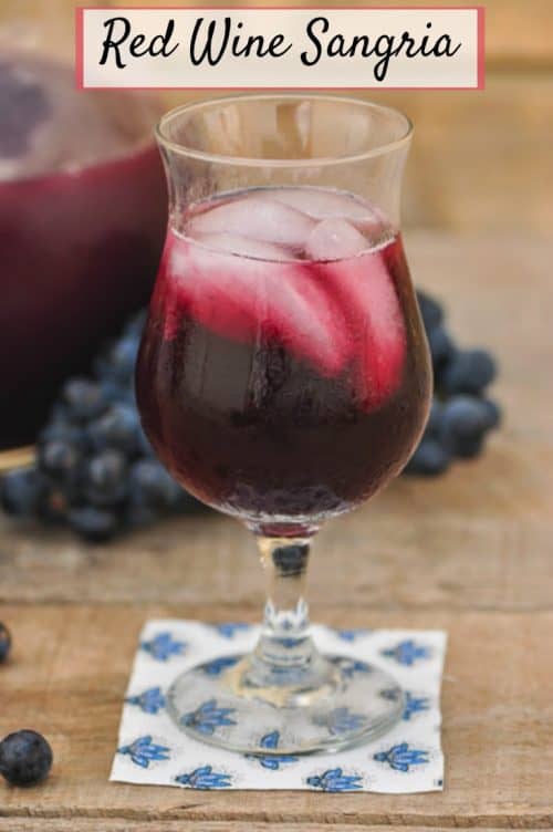 single glass of red wine sangria shown on table