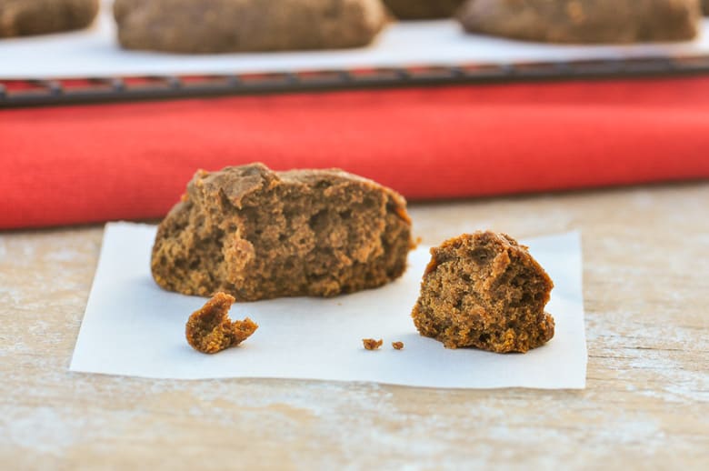 A side shot of pumpkin spice cookies half eaten