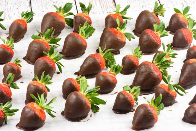 Chocolate Covered Strawberries with Coconut Oil Chocolate sitting on a large tray