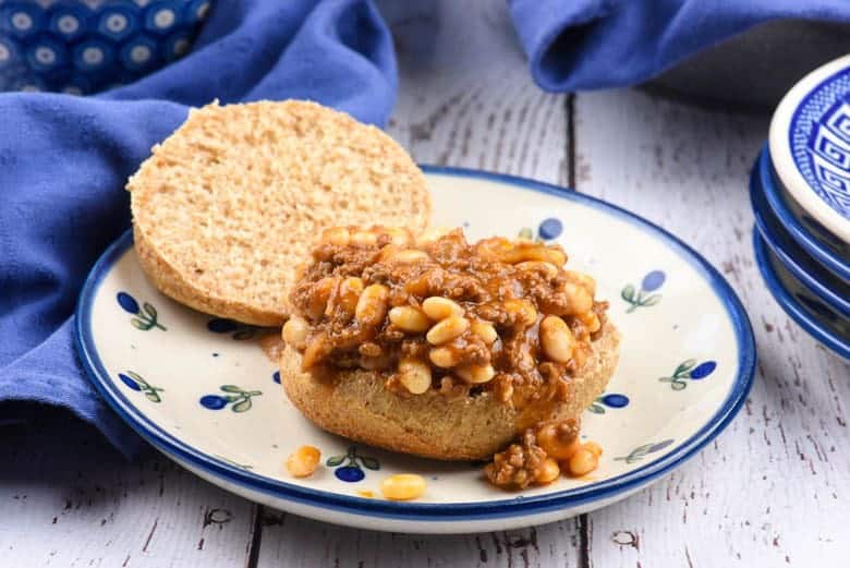 A close up of easy sloppy joes made with beef and beans on a white plate