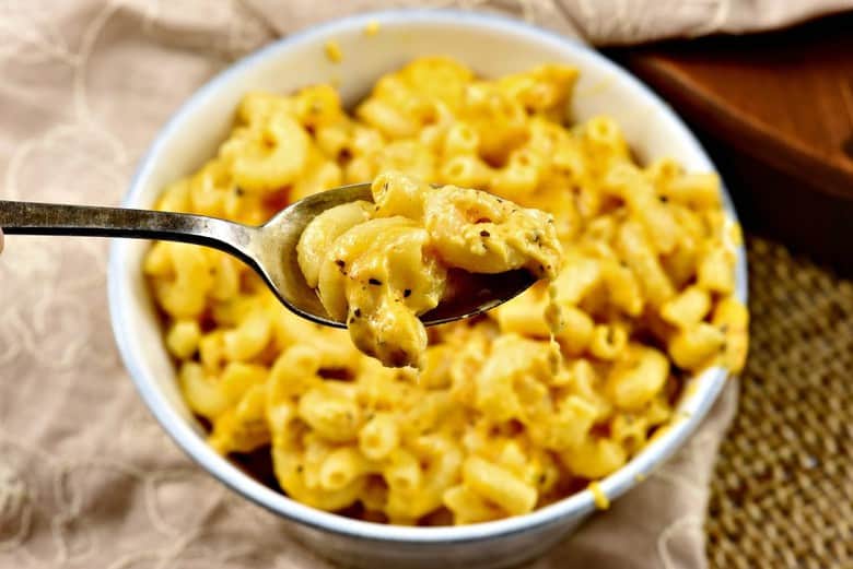 Creamy Macaroni and Cheese recipe shown cooked in bowl and ready to eat