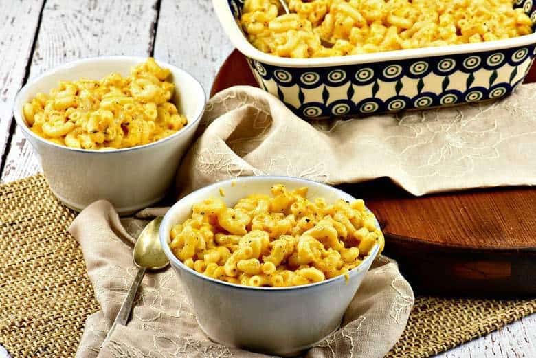 A photo of Creamy Macaroni and Cheese in two white bowls on a table