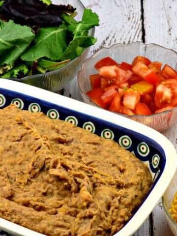 Homemade Refried Beans in a large baking dish on a table