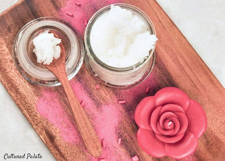 Homemade Peppermint Sugar Scrub Recipe shown on tray with a candle