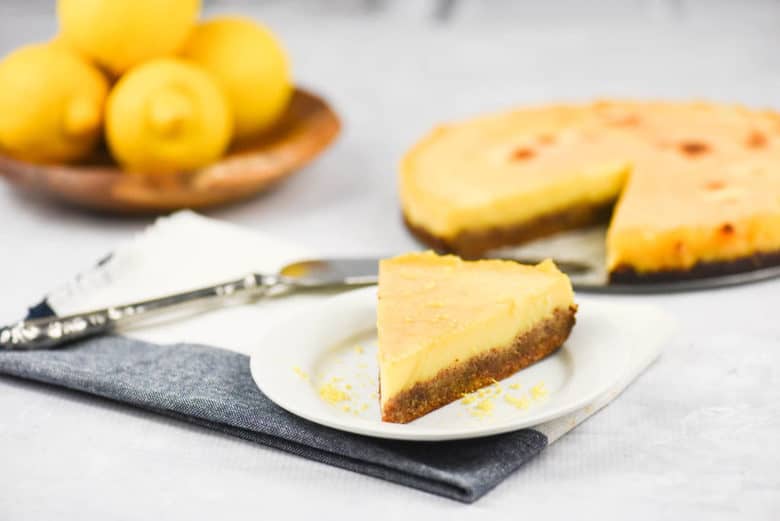 A side shot of a slice of easy lemon tart on a plate