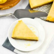 A photo of an easy lemon tart with a slice cut out