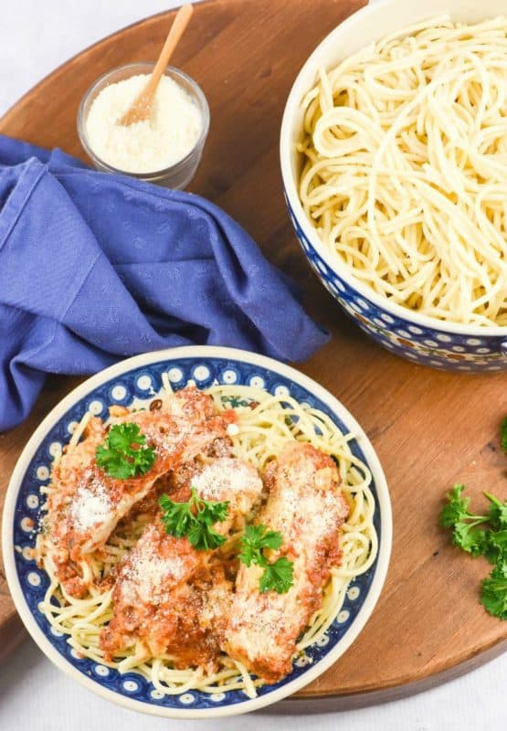 Chicken Parmesan on plate of noodles made from Crock Pot Chicken Parmesan recipe