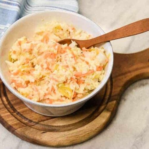 Creamy Coleslaw - Easy Coleslaw Recipe shown in a small bowl with spoon