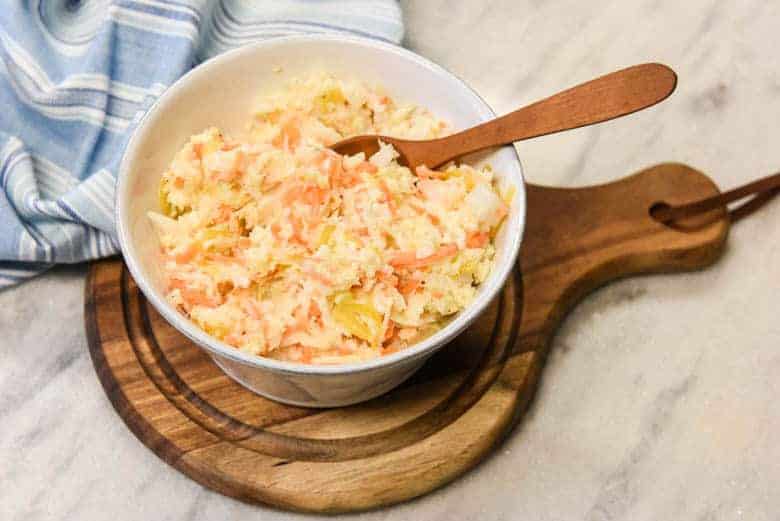 Creamy Coleslaw - Easy Coleslaw Recipe shown in a small bowl with spoon
