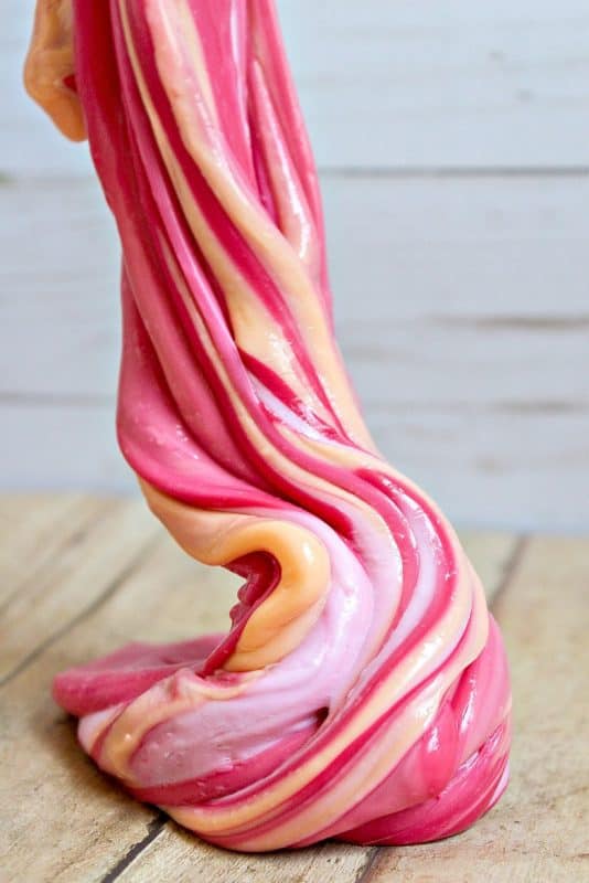 A vertical photo of 3 color swirled slime from Homemade Slime Recipe Without Borax