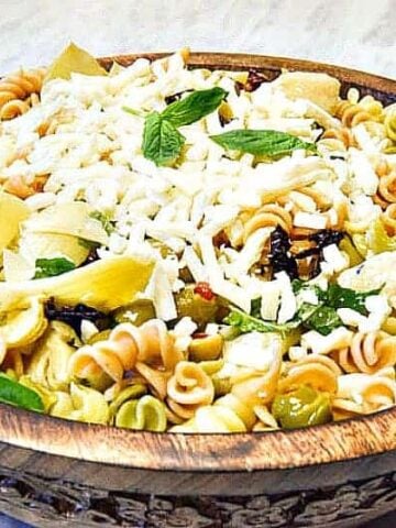 Italian Pasta Salad shown in a wooden bowl ready to serve