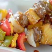 Kabob recipe shown with peppers onions beef and pineapple