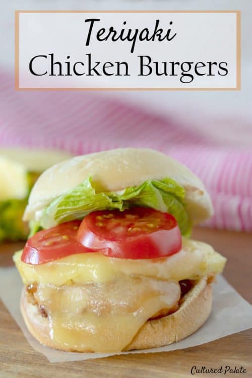 Chicken Burgers shown ready to eat on wooden table