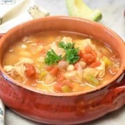 close-up of red bowl of instant pot white chicken chili