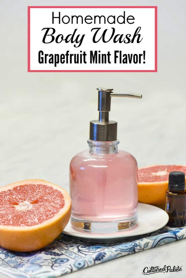 vertical image of grapefruit mint homemade body wash in a glass pump jar with grapefruit to the side