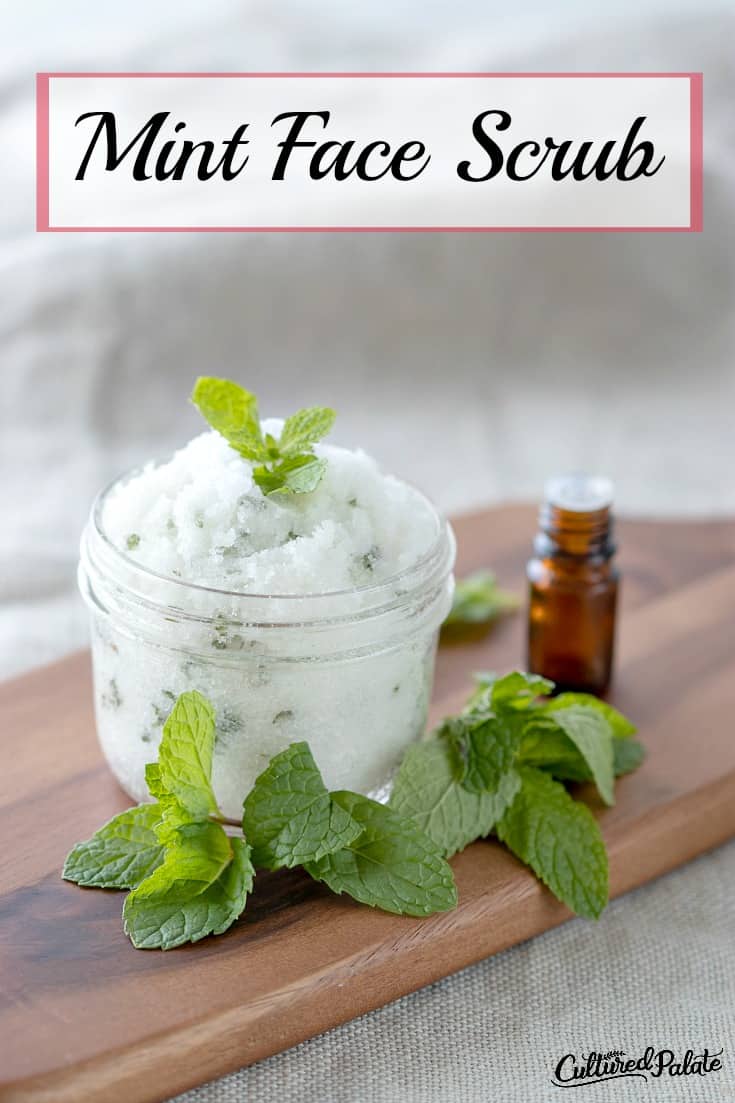 Sugar Scrub - Mint Face Scrub is shown in glass jar with mint leaves and essential oil bottle with text overlay