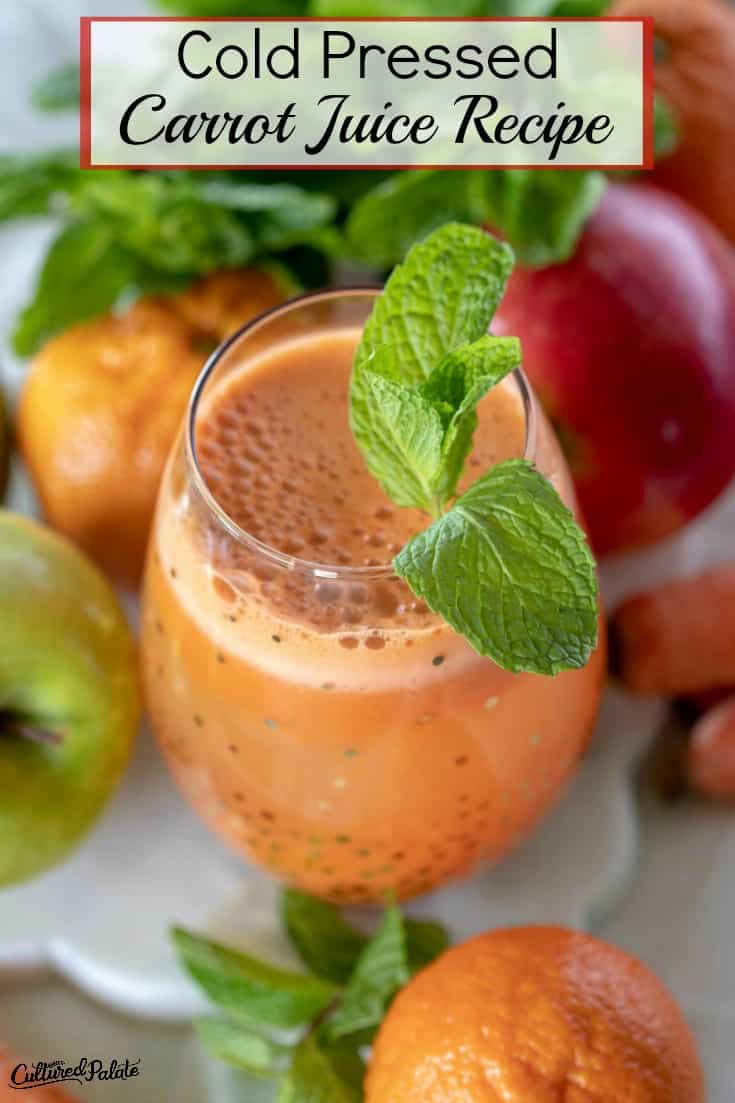 Cold Pressed Carrot Juice Recipe shown from overhead with mint on side of glass.