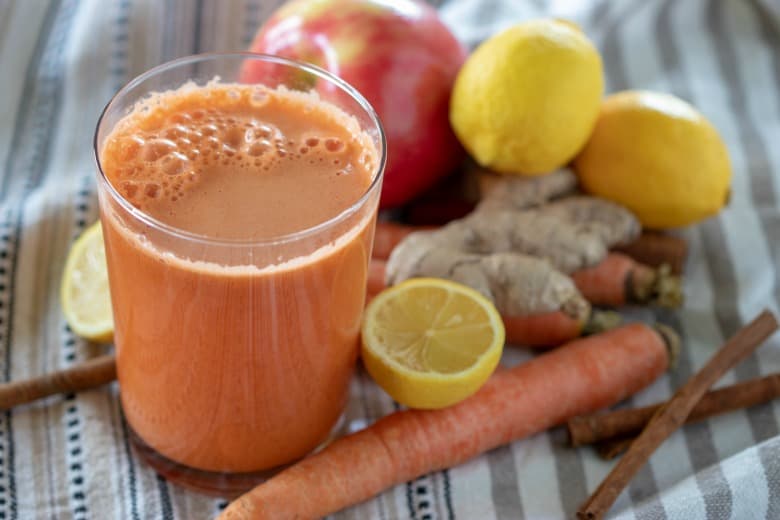 Indian Style Carrot Juice Recipe shown ready to drink in glass.