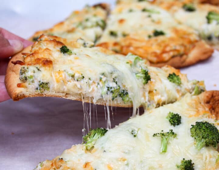 slice of naan bread pizza with cheese and broccoli