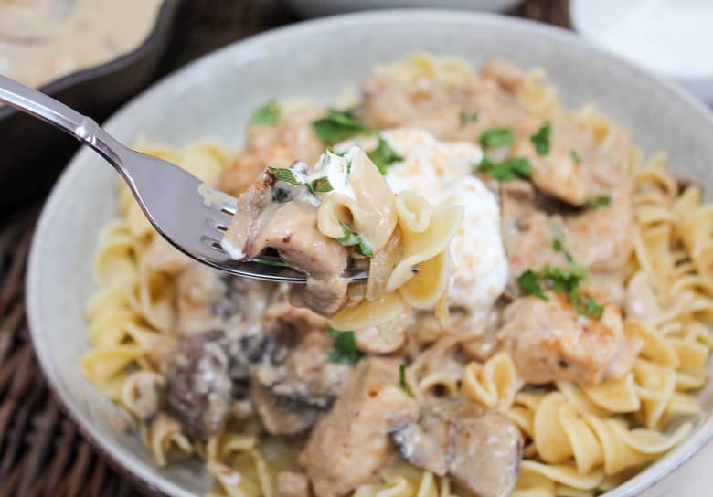 chicken stroganoff in a bowl with a fork